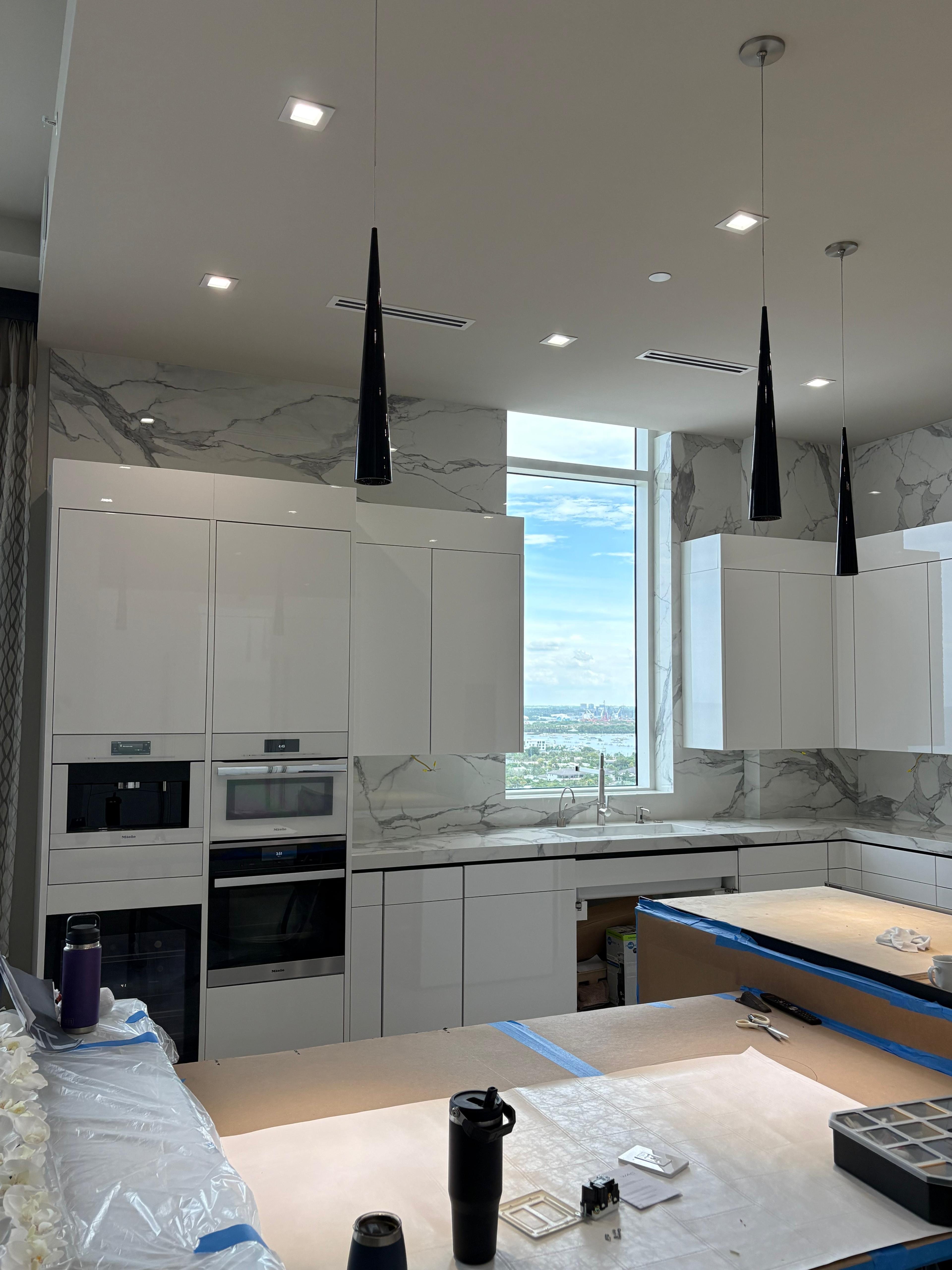 Tall Calacatta panels framing a city-view window